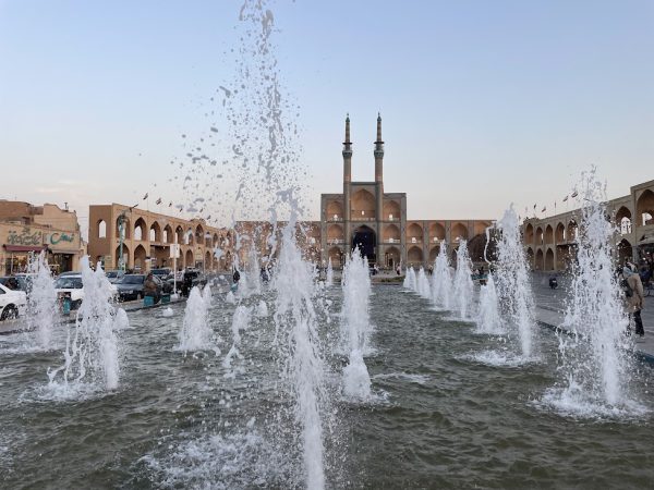 Tourists at Amir Chakhmaq Square in Yazd, facing the three-story fa&ccedil;ade of the mosque and tekyeh | Iran&rsquo;s Travel