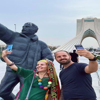 happy tourists capturing photo in Azadi tower