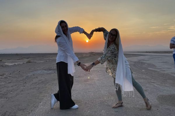 Mesr Desert at sunrise with golden light casting long shadows over the dunes | Iran&rsquo;s Travel